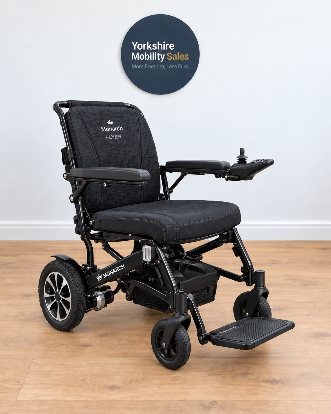 Monarch Flyer Powerchair in Sapphire Black on Yorkshire Mobility Sales background