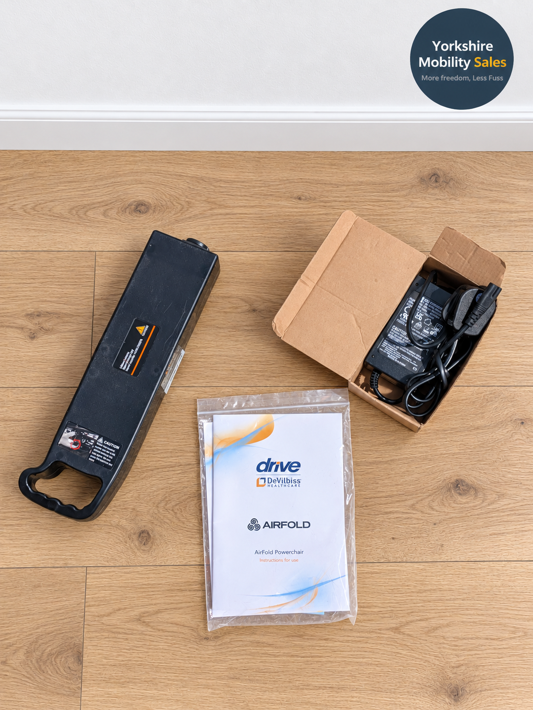 Preloved Drive AirFold – included battery charger and manual